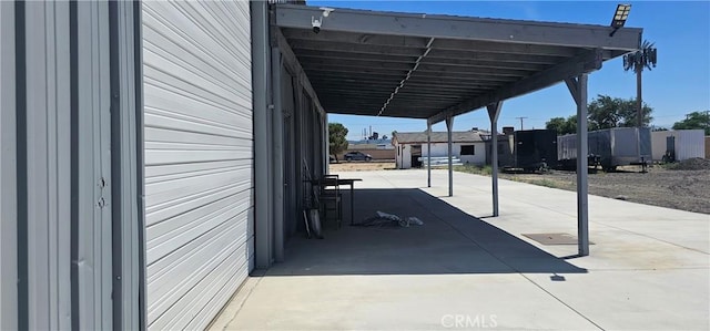 45219 12th St, Lancaster, CA 93535 - view of parking with an attached carport and driveway