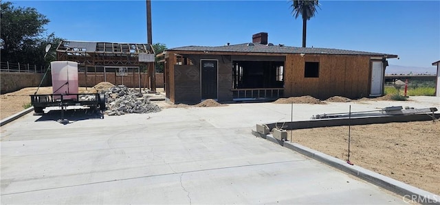 45219 12th St, Lancaster, CA 93535 - rear view of house featuring a chimney