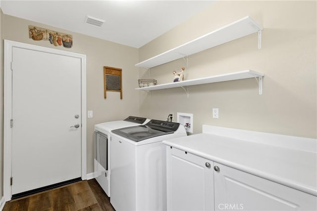 31956 Via Del Paso, Winchester, CA 92596 - laundry room featuring washing machine and clothes dryer, dark wood finished floors, and cabinet space