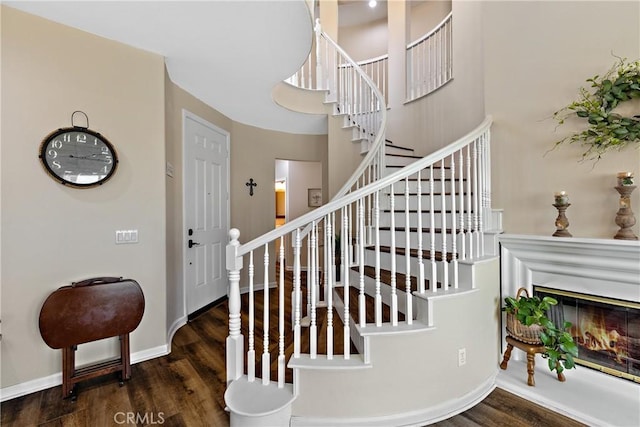 31956 Via Del Paso, Winchester, CA 92596 - stairs with wood finished floors, a glass covered fireplace, and a high ceiling