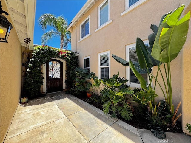 31956 Via Del Paso, Winchester, CA 92596 - doorway to property featuring stucco siding and a gate