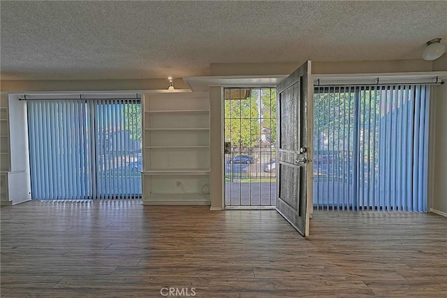 1209 Edwards St Unit 56, Redlands, CA 92374 - empty room with a textured ceiling, wood finished floors, and plenty of natural light
