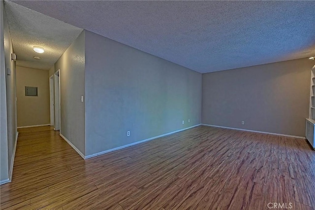 1209 Edwards St Unit 56, Redlands, CA 92374 - empty room with a textured ceiling and wood finished floors