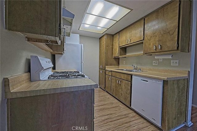 1209 Edwards St Unit 56, Redlands, CA 92374 - kitchen featuring white appliances, light wood finished floors, and light countertops