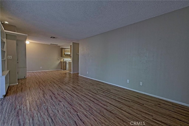 1209 Edwards St Unit 56, Redlands, CA 92374 - unfurnished room with dark wood-style floors and a textured ceiling