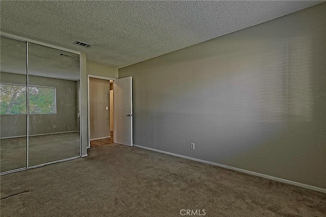 1209 Edwards St Unit 56, Redlands, CA 92374 - unfurnished bedroom featuring carpet, a closet, and a textured ceiling