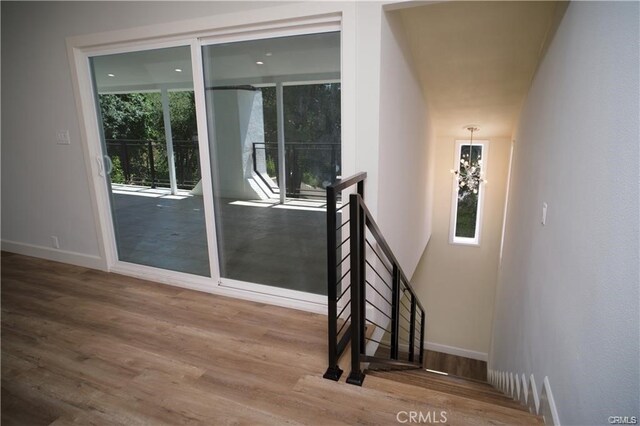 1020 Lantana Dr, Los Angeles, CA 90042 - staircase with wood finished floors and baseboards