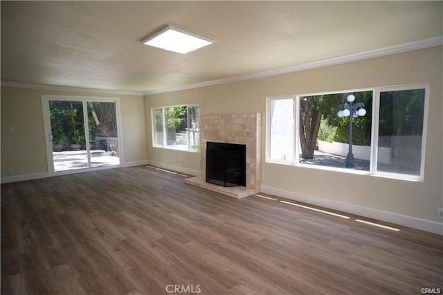 1020 Lantana Dr, Los Angeles, CA 90042 - unfurnished living room with ornamental molding, dark wood-style floors, and a fireplace with raised hearth