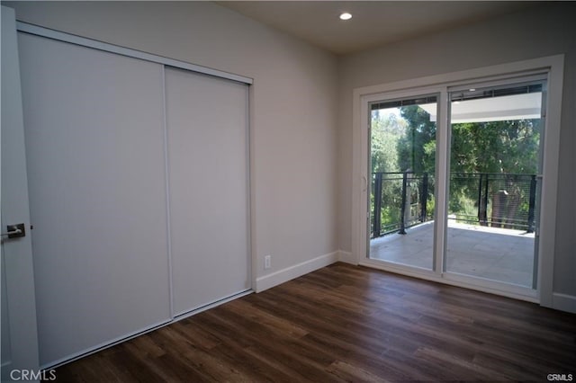 1020 Lantana Dr, Los Angeles, CA 90042 - unfurnished bedroom featuring access to outside, dark wood-style floors, recessed lighting, and a closet