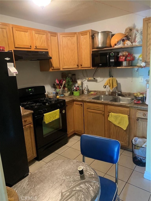 1017 W Bishop St Unit 202, Santa Ana, CA 92703 - kitchen with black appliances, under cabinet range hood, light tile patterned floors, and open shelves