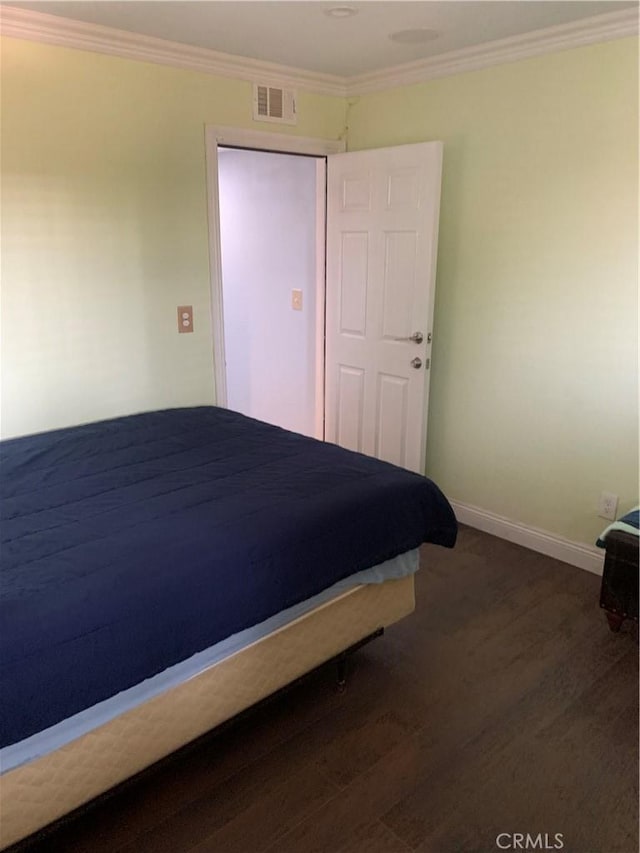 1017 W Bishop St Unit 202, Santa Ana, CA 92703 - bedroom with dark wood finished floors and crown molding