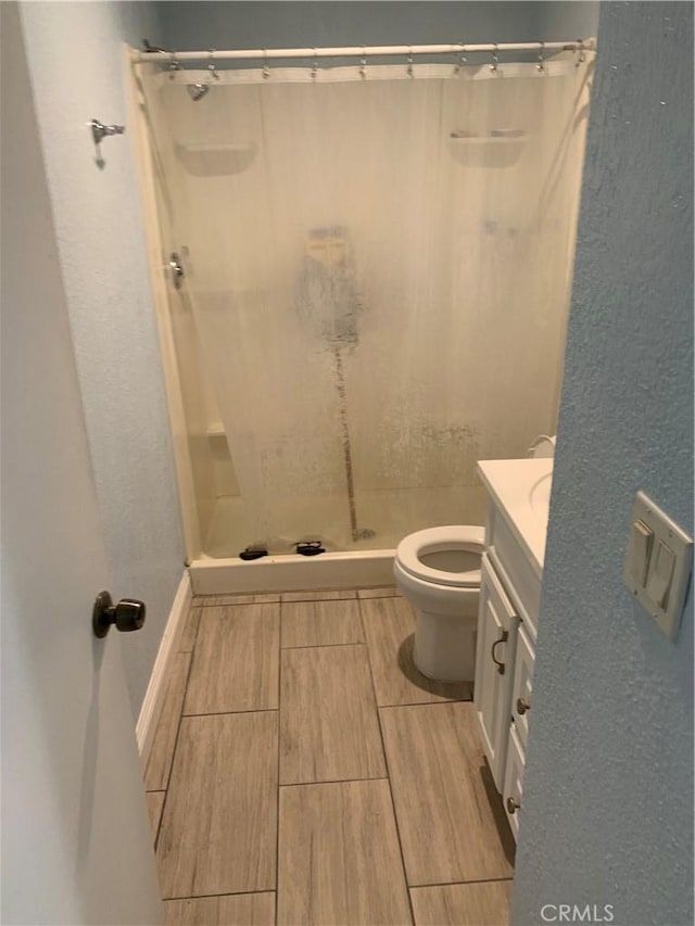 1017 W Bishop St Unit 202, Santa Ana, CA 92703 - bathroom with vanity, wood finish floors, and a shower stall