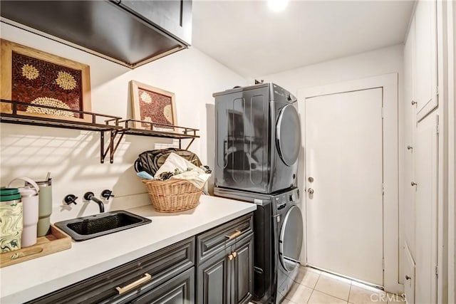 458 Termino Ave, Corona, CA 92879 - laundry room featuring cabinet space, estacked washer and dryer, and light tile patterned floors