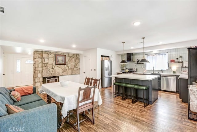 458 Termino Ave, Corona, CA 92879 - dining space featuring a fireplace, wood finished floors, and recessed lighting