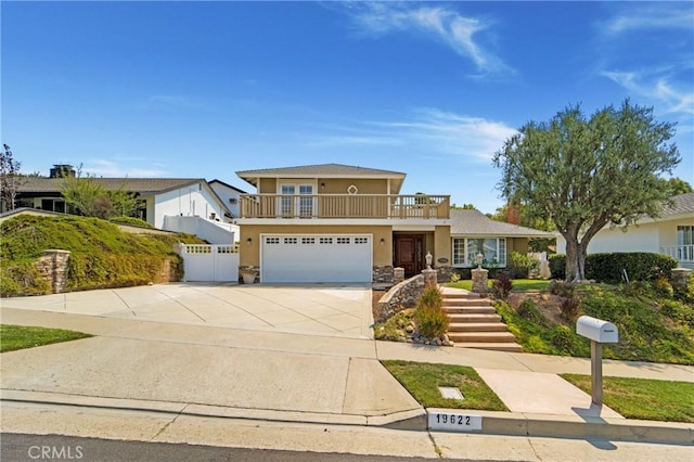 19622 Crestknoll Dr, Yorba Linda, CA 92886 - view of front of home featuring a balcony, a garage, stucco siding, driveway, and stone siding
