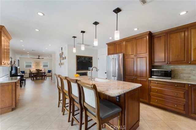 19622 Crestknoll Dr, Yorba Linda, CA 92886 - kitchen featuring stainless steel appliances, a ceiling fan, decorative backsplash, brown cabinets, and recessed lighting