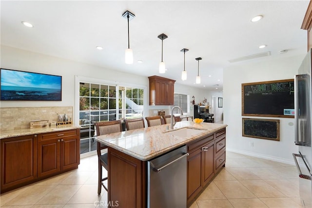 19622 Crestknoll Dr, Yorba Linda, CA 92886 - kitchen with appliances with stainless steel finishes, light stone countertops, light tile patterned floors, pendant lighting, and a kitchen breakfast bar