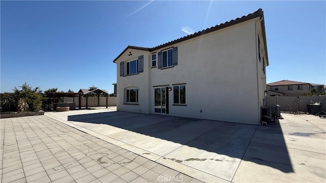 1167 Tesoro Pl, Vista, CA 92081 - back of property featuring a fenced backyard, a patio, and stucco siding