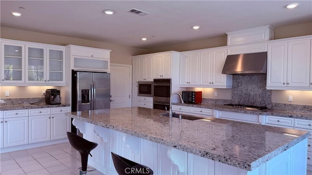 1167 Tesoro Pl, Vista, CA 92081 - kitchen featuring range hood, stainless steel appliances, white cabinets, a breakfast bar area, and recessed lighting