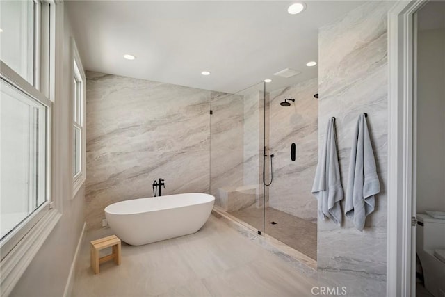 4 Ebony Glade, Laguna Niguel, CA 92677 - bathroom featuring tile walls, a marble finish shower, a freestanding bath, and recessed lighting