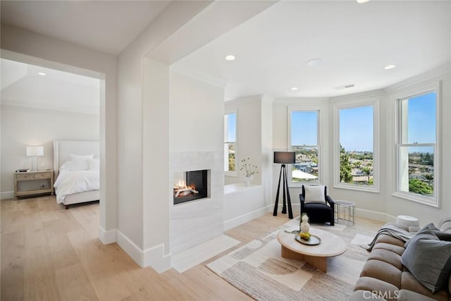 4 Ebony Glade, Laguna Niguel, CA 92677 - living area with a multi sided fireplace, crown molding, light wood-style floors, and recessed lighting