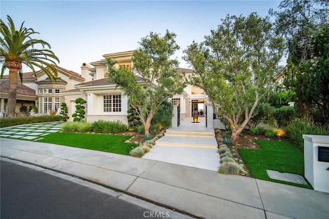 4 Ebony Glade, Laguna Niguel, CA 92677 - view of front facade with stone siding, stucco siding, and a front yard