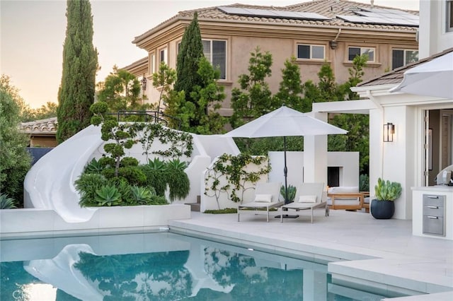 4 Ebony Glade, Laguna Niguel, CA 92677 - pool at dusk featuring a patio and an outdoor pool