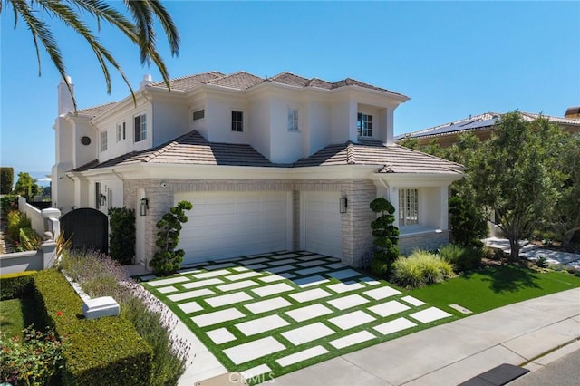 4 Ebony Glade, Laguna Niguel, CA 92677 - mediterranean / spanish house with driveway, stone siding, an attached garage, a tile roof, and stucco siding