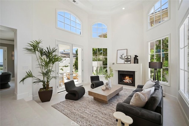 4 Ebony Glade, Laguna Niguel, CA 92677 - living area with ornamental molding, a high ceiling, a lit fireplace, and recessed lighting