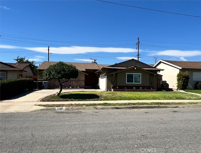 1135 W Coolfield Dr, Covina, CA 91722 - single story home featuring a garage, a front yard, driveway, and stucco siding
