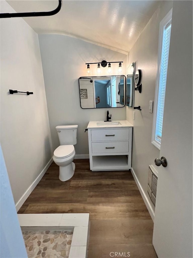 1135 W Coolfield Dr, Covina, CA 91722 - bathroom with lofted ceiling, vanity, and wood finished floors