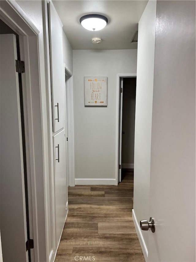 1135 W Coolfield Dr, Covina, CA 91722 - hallway featuring dark wood-style floors and baseboards