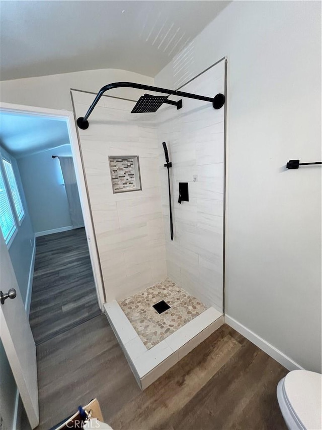 1135 W Coolfield Dr, Covina, CA 91722 - full bath with tiled shower, wood finished floors, and vaulted ceiling
