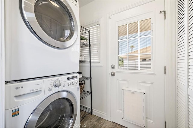 744 S 5th St, Montebello, CA 90640 - laundry area featuring estacked washer and dryer and wood finished floors