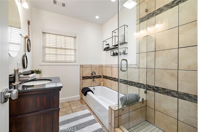 744 S 5th St, Montebello, CA 90640 - full bathroom with tile patterned flooring, a garden tub, a shower stall, and vanity