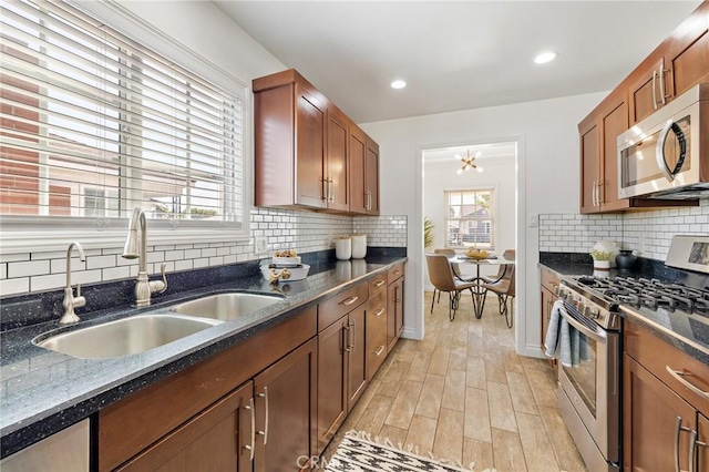 744 S 5th St, Montebello, CA 90640 - kitchen featuring appliances with stainless steel finishes, decorative backsplash, light wood finished floors, brown cabinets, and recessed lighting