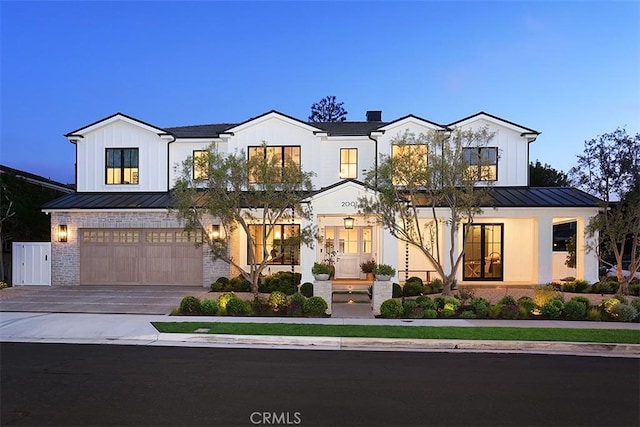 2001 Port Ramsgate Pl, Newport Beach, CA 92660 - modern inspired farmhouse with a standing seam roof, board and batten siding, and concrete driveway