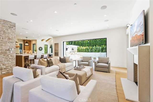 2001 Port Ramsgate Pl, Newport Beach, CA 92660 - living room with a fireplace, light wood-style floors, and recessed lighting