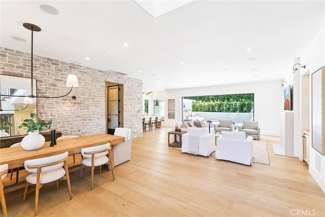 2001 Port Ramsgate Pl, Newport Beach, CA 92660 - dining area featuring light wood-style flooring, brick wall, and recessed lighting