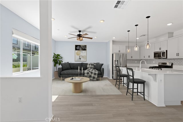 35115 Vine Pl, Fallbrook, CA 92028 - living room with ceiling fan, recessed lighting, and light wood-type flooring