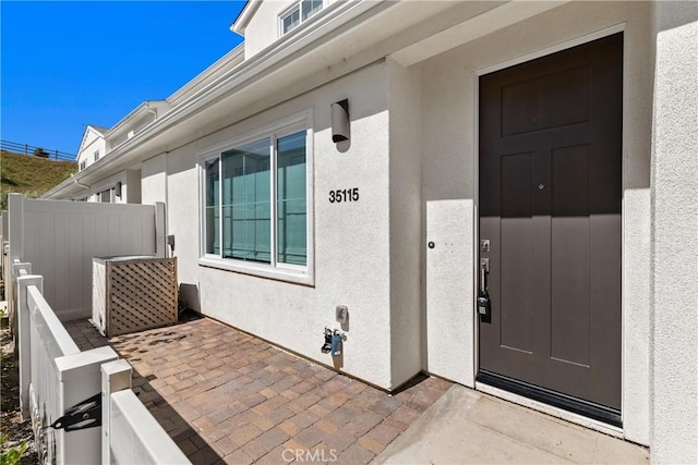 35115 Vine Pl, Fallbrook, CA 92028 - doorway to property with stucco siding and a patio area