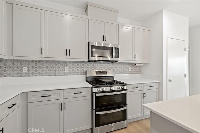 35115 Vine Pl, Fallbrook, CA 92028 - kitchen featuring appliances with stainless steel finishes, light countertops, and backsplash