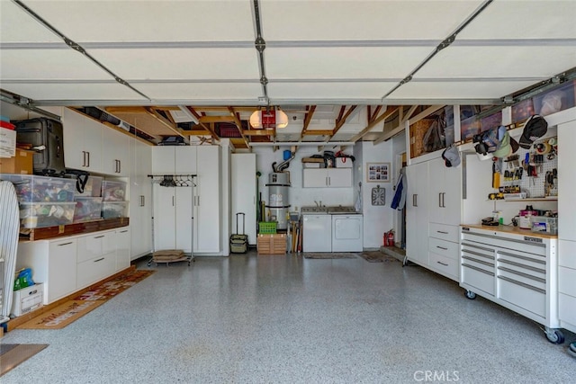 10 Glenhurst Unit 37, Irvine, CA 92604 - garage featuring washer and dryer and a central vacuum unit