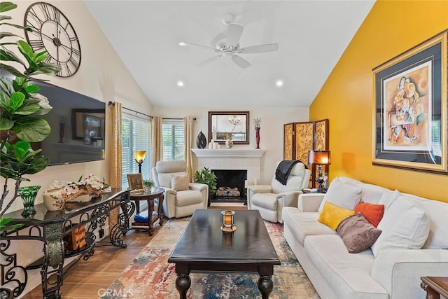 10 Glenhurst Unit 37, Irvine, CA 92604 - living room featuring vaulted ceiling, ceiling fan, wood finished floors, a fireplace, and recessed lighting