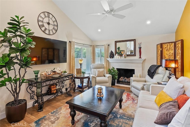 10 Glenhurst Unit 37, Irvine, CA 92604 - living room with vaulted ceiling, wood finished floors, a ceiling fan, a fireplace, and recessed lighting