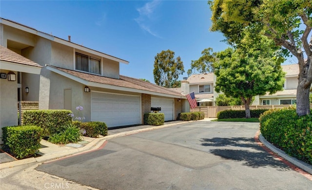 10 Glenhurst Unit 37, Irvine, CA 92604 - view of front of home featuring stucco siding and driveway