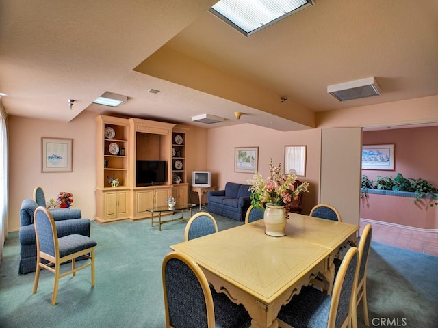 11410 Dolan Unit 328, Downey, CA 90241 - carpeted dining space featuring baseboards