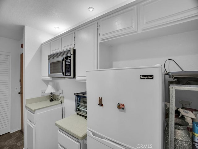 11410 Dolan Unit 328, Downey, CA 90241 - kitchen with refrigerator, stainless steel microwave, and light countertops