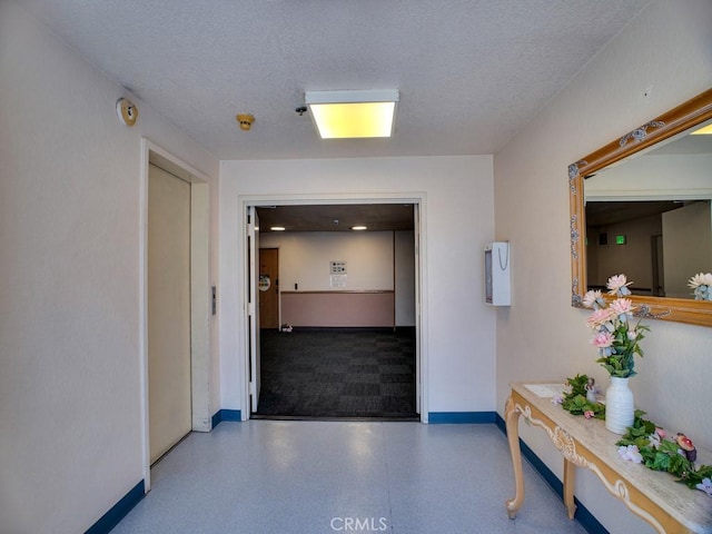 11410 Dolan Unit 328, Downey, CA 90241 - hallway with baseboards and a textured ceiling