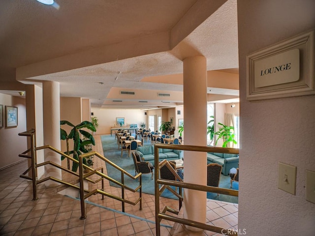 11410 Dolan Unit 328, Downey, CA 90241 - building lobby featuring a textured ceiling and a textured wall